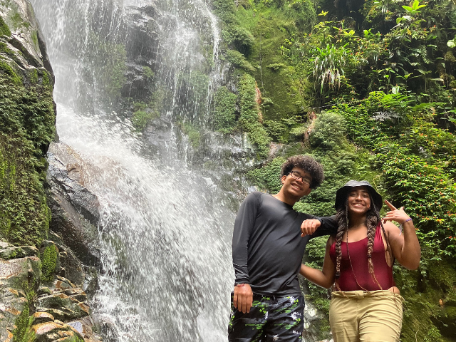 Ecuador students standing at waterfall