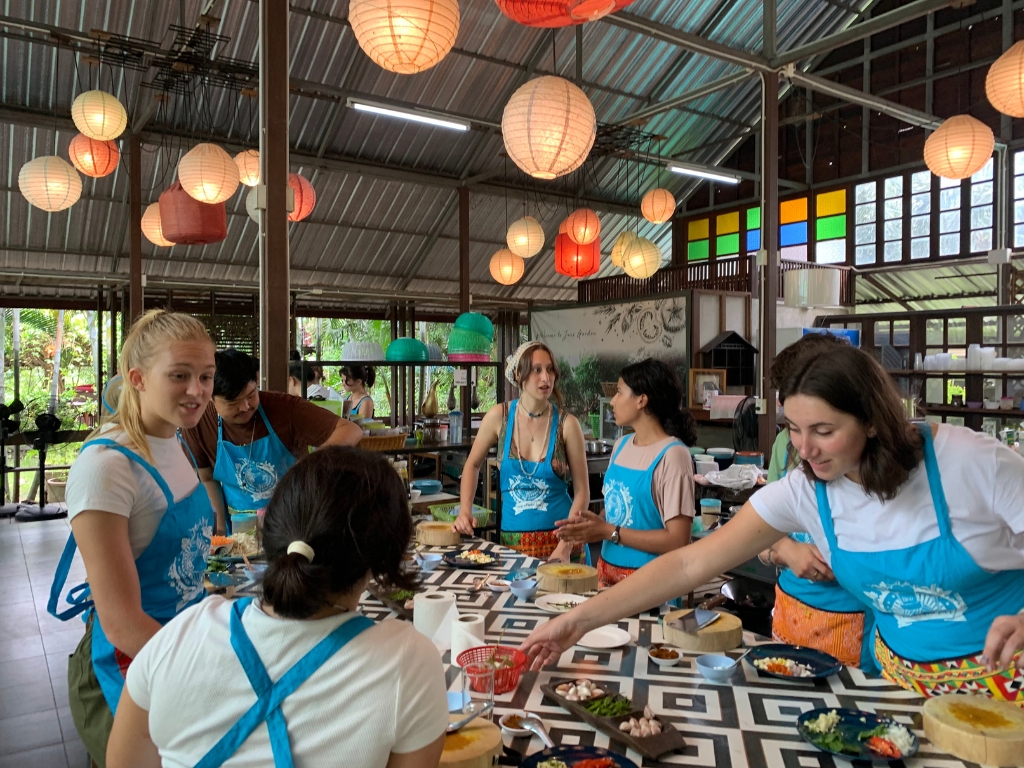 Type thing class with blue aprons and paper lanter