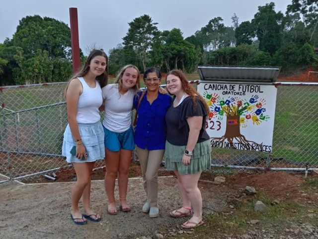 students in host family community posing