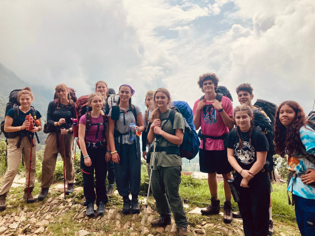 students gathered on a trekking break