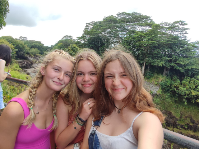 girls together outside students selfie