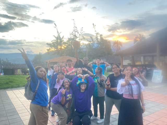 group peace signs at sunset