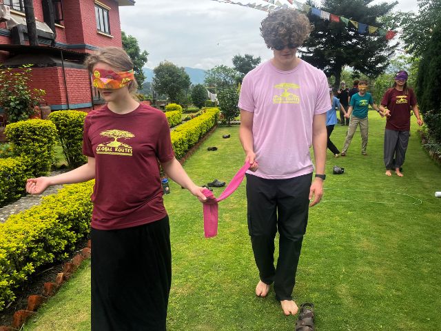 Global Routes shirts blindfolded games outside