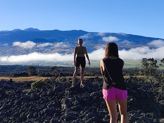 2023-hi-cloudcover standing near volcano black sand beach