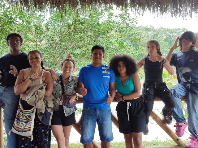 Students posing with rafting guides