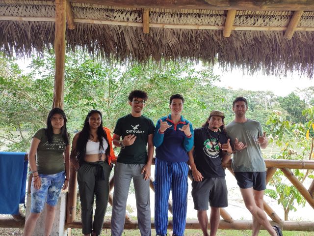 Students posing with rafting guides