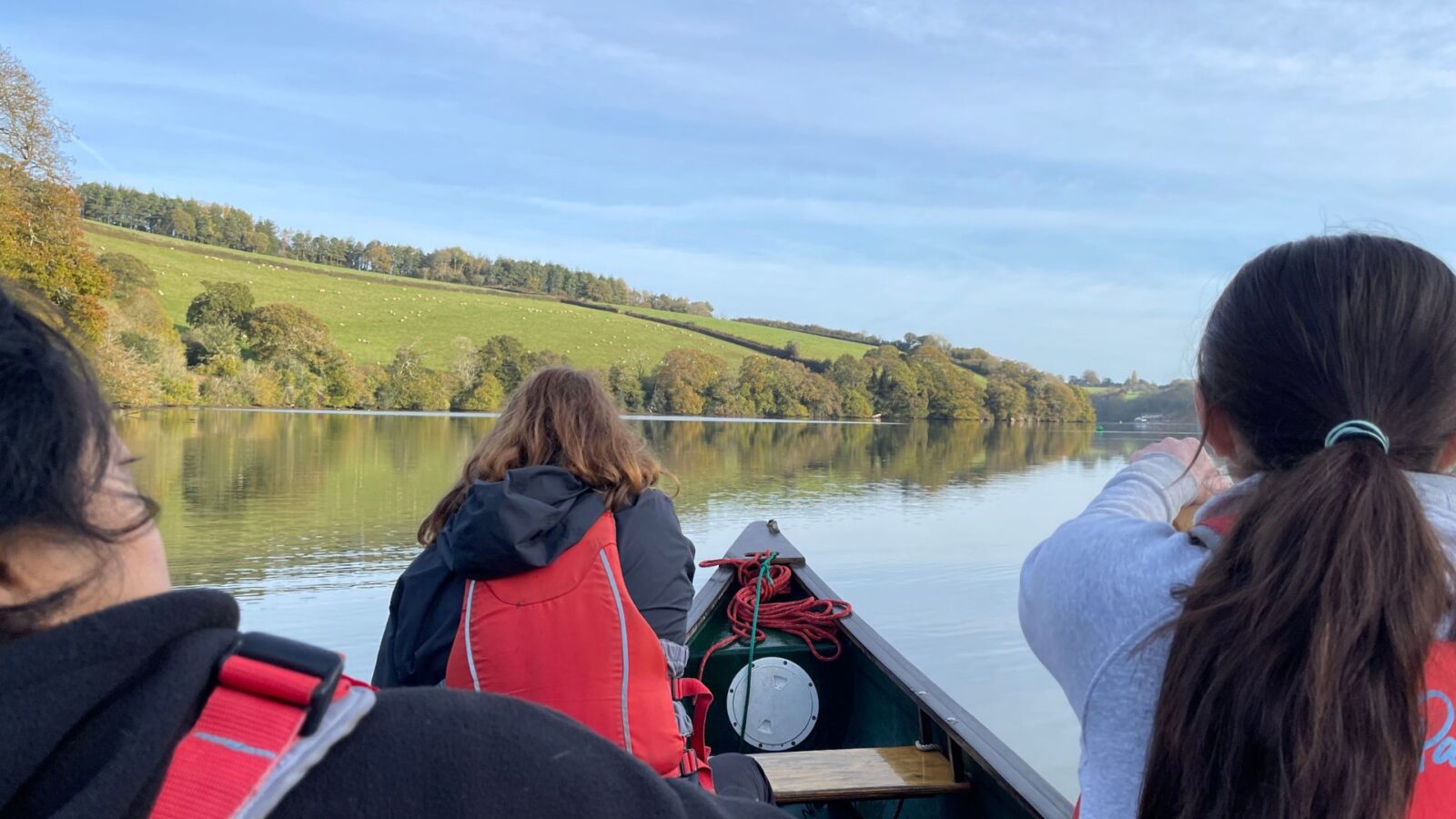 students riding in boat ride on english waterway